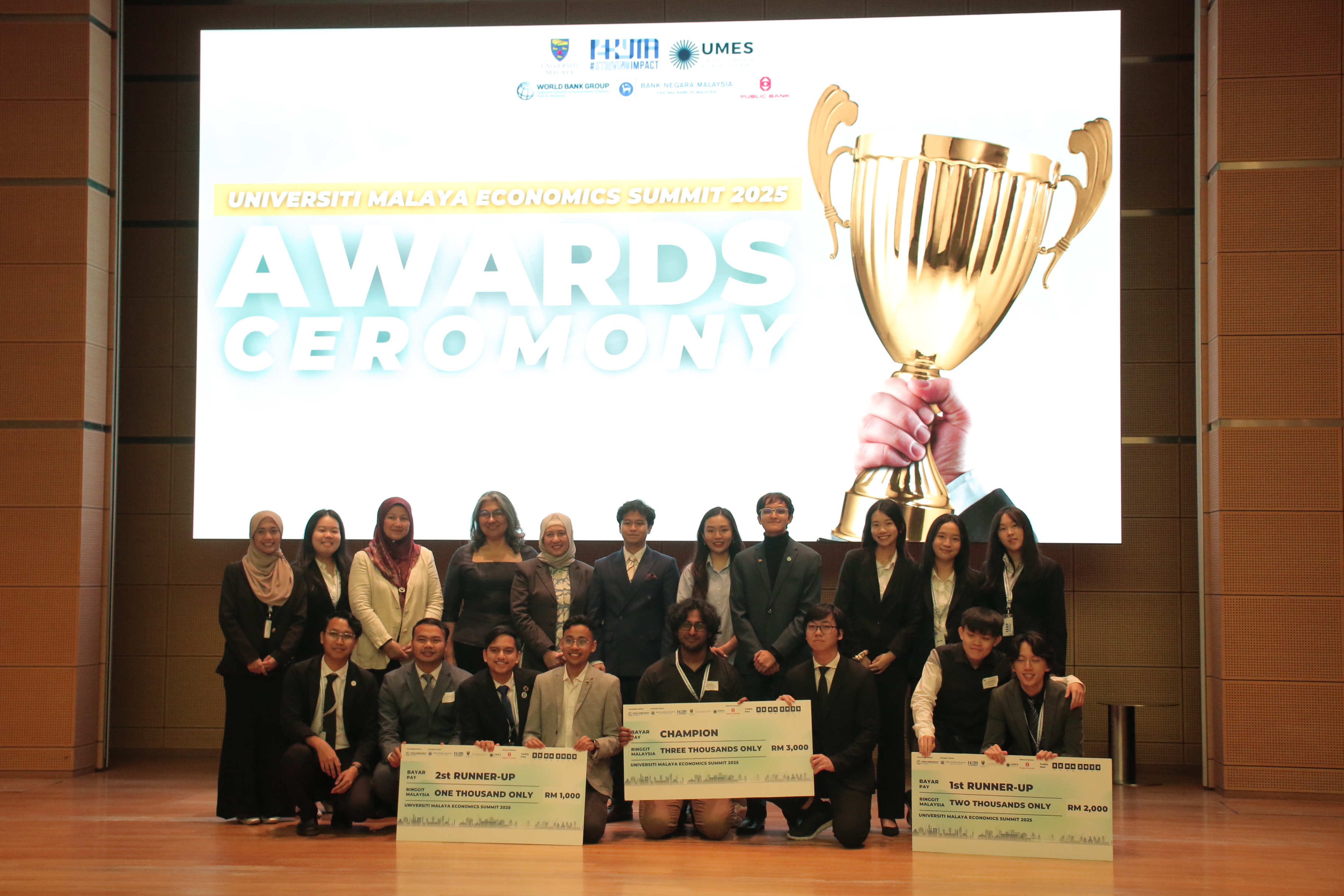 UMES 2025 Awards Ceremony with winners holding prize checks